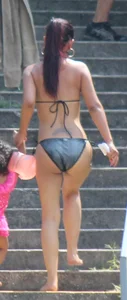 Sexy brunette milf in a bikini with a great body, nice ass and some camel toe