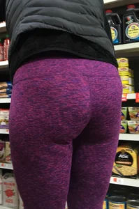 Milf shopping with a nice ass in purple leggings