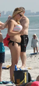 Big boobed thick blonde on the beach in a bikini