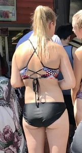 Two sexy blondes at a water park with nice asses in bikinis
