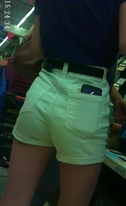 Cute skinny girl shopping in white denim shorts