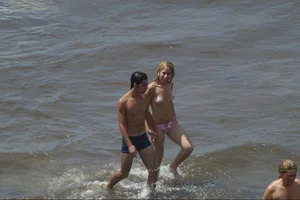 Girls on a nude beach in Sitges, Spain
