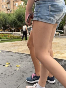 Candid teen wearing denim shorts passing by, nice legs