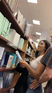 Pretty babe in tight jeans showing nipples in book store w bf (Not OC)(Face shot)