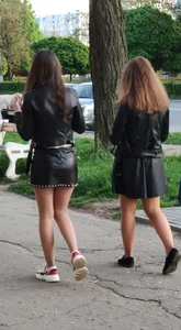 Two college girls wearing leather skirts walking down the street creepshots