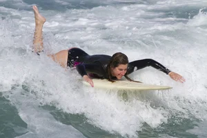 Candid surfer babes on the beach and in bikinis