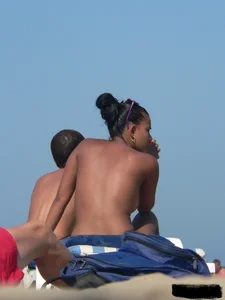 Hot ass topless beach girl with great tits lets her little brother oil up her ass in thong bikini