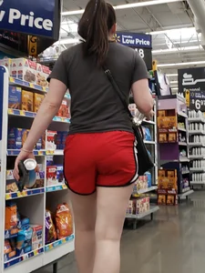 Couple of teens wearing shorts at the supermarket