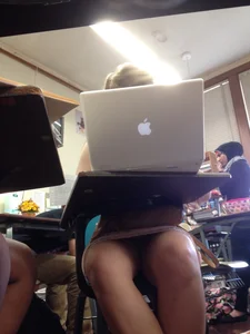 College Candid Girl in a Skirt With Her Laptop in Class