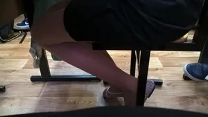 Skinny Legs in Flats under Desk Candid Closeup