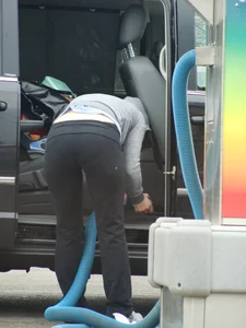 Girls cleaning their cars in jeans and pants