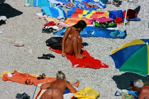 Ula FKK Sexy brunette on a nude beach topless, bottomless and with blue thong
