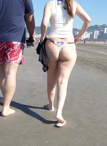 Big booty beach babe in thong bikini