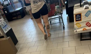 Milf in black biker shorts and flip flops
