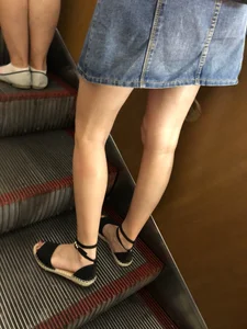 Girl in a Denim Skirt Standing on a Subway Escalator Low Angle Creepshots