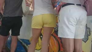 Milf in yellow shorts with vpl and a wedgie