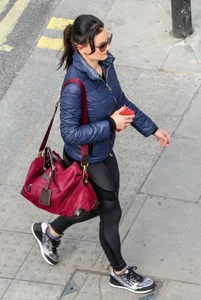 Brunette lady in leggings out walking