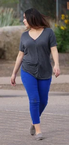 Sexy dog walker in shorts and tank top with friend in blue jeans