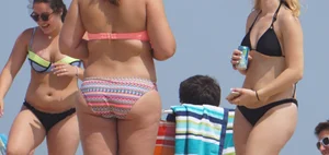 Thick girl on the beach in a bikini