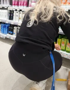 Blonde squatting with nice ass packed in leggings