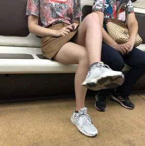 Amazing Hot Girl in a Skirt and Sneakers Sitting Cross-Legged in the Subway Train and on the Escalator Candid Photos Gallery