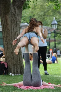 Gymnast or yoga girl in the park in shorts and no bra and even showing some pussy