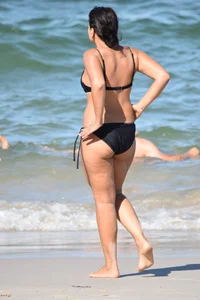 Thick mature brunette bikini lady on the beach with a nice body
