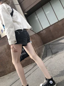 Cute candid teen with pale slim legs in shorts