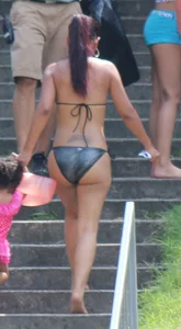 Sexy brunette milf in a bikini with a great body, nice ass and some camel toe