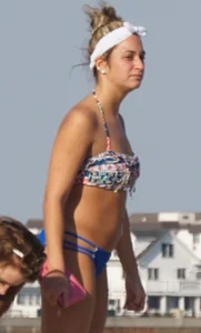 Beach babe in a blue bikini with thick friend in shorts