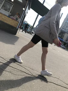 Hot slim legs in shorts of a candid girl in a public bus