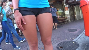 Skinny sexy girl buying ice cream in tight spandex shorts with a nice ass, gap, and camel toe