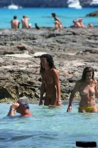 Nude beach ladies in the water showing their tits