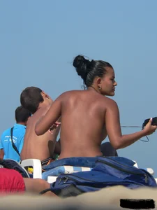 Hot ass topless beach girl with great tits lets her little brother oil up her ass in thong bikini