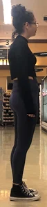 Girl with glasses shopping in leggings showing her VPL