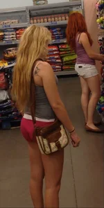 Two Walmart sexy babes in shorts with nice asses
