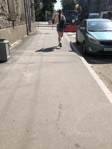 Girl with awesome pale legs in shorts wearing a backpack street creepshots