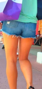 Candid girl in denim shorts with nice legs and showing her cheeks