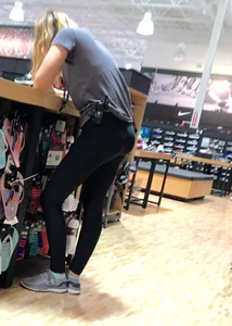 Shoe store employee with a sexy bubble butt in leggings