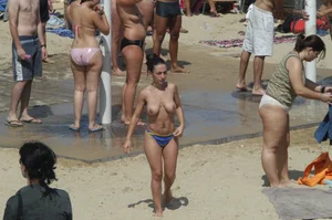 Topless girls on a beach in Barcelona