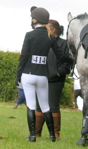 Candid girl in a horse riding uniform