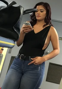 Thick brunette in tight jeans and showing some side boob