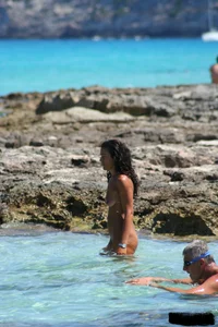 Nude beach ladies in the water showing their tits
