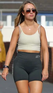 Blonde woman in lycra shorts - good front view, back view ruined by a bag