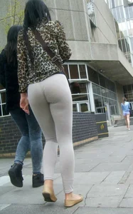 Brunette lady with a nice ass in light grey leggings walking
