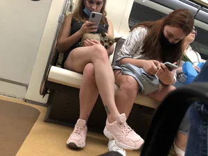 Girl With Hot Legs Sitting in a Subway Train With a Small Dog on Her Lap Creepshots