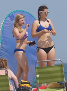 3 girls on the beach in bikinis with big boobs, one brunette and two blondes