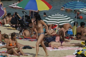 Topless girls on a beach in Barcelona