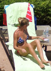 Blonde babe at the pool with sexy body in USA bikini