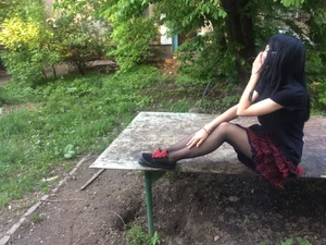Teen JB Sitting in a Skirt, Skinny Legs